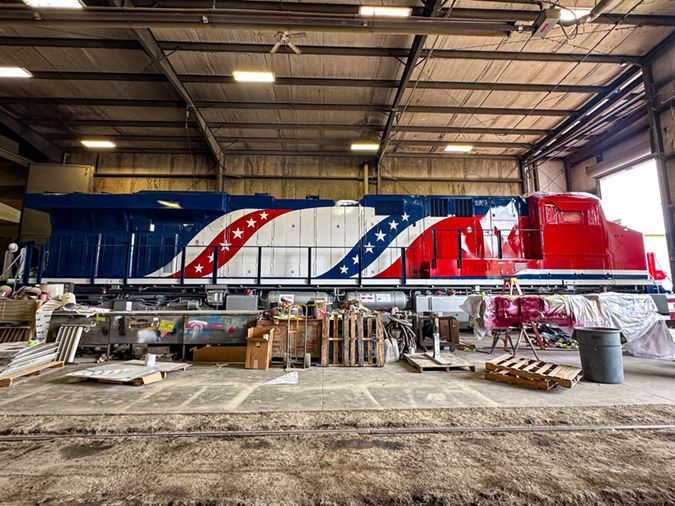 One of three locomotives receiving the 250th paint scheme nears completion. 