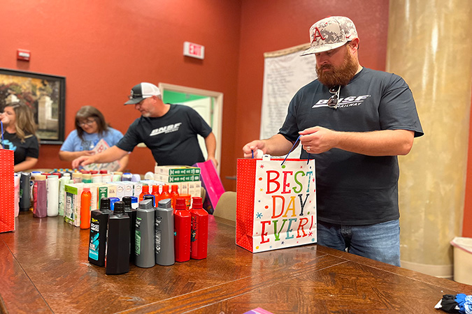 BNSF and CASA team members package gifts