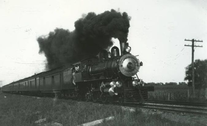 A CB&Q train travelling at full speed toward Chicago 