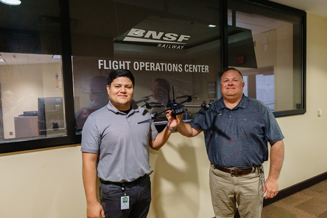 Technology Services Manager Michael Ibanez, left, and Technology Services Director John Martin with a drone outside the Flight Operations Center Technology Services Manager Michael Ibanez, left, and Technology Services Director John Martin with a drone outside the Flight Operations Center